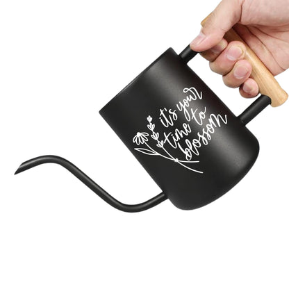 Black coffee pot with wooden handle and motivational quote on a white background