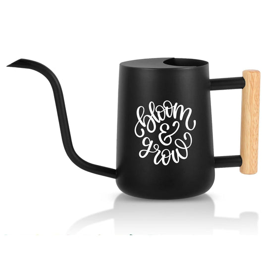 Black watering can with wooden handle and 'Bloom & Grow' text on a white background