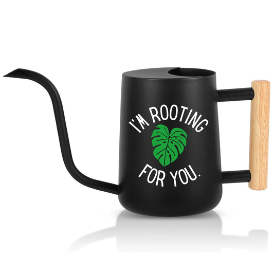 Black watering can with wooden handle and text 'I'm Rooting For You' on a white background