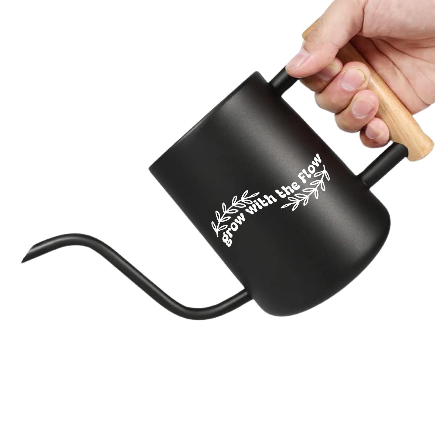 Black gooseneck watering can with wooden handle held by a hand on a white background