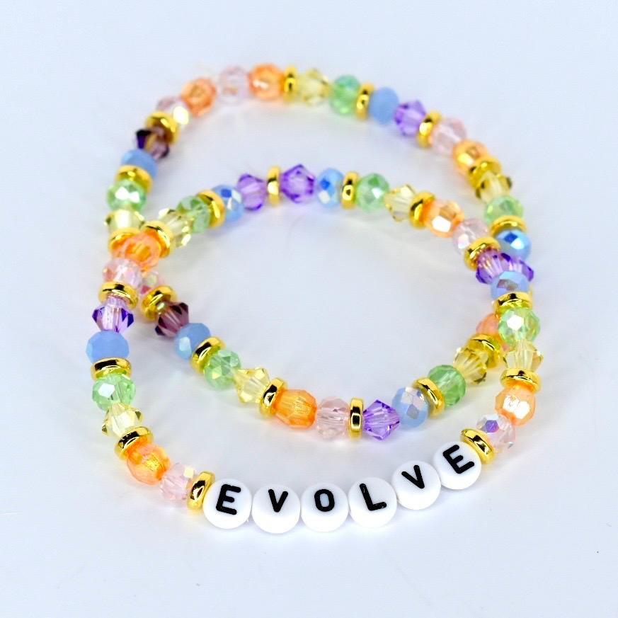 Pastel  colored crystal beads with gold accents and letters spelling evolve bracelet stack for wrist or tumbler Stanley