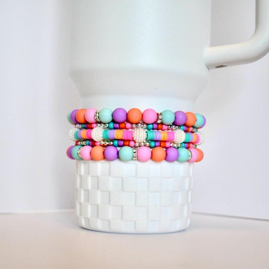 Big and small pastel beaded bracelet with silver and sparkle accents for wrist or tumbler.