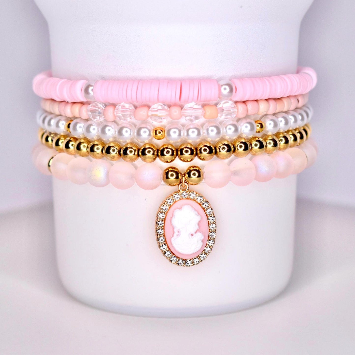 pink gold pearl and sparkly beads with pink cameo charm surrounded by sparkles.  set of five bracelets for wrist or tumbler