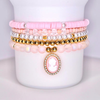 pink gold pearl and sparkly beads with pink cameo charm surrounded by sparkles.  set of five bracelets for wrist or tumbler