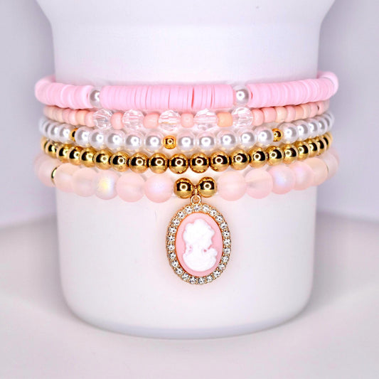 pink gold pearl and sparkly beads with pink cameo charm surrounded by sparkles.  set of five bracelets for wrist or tumbler