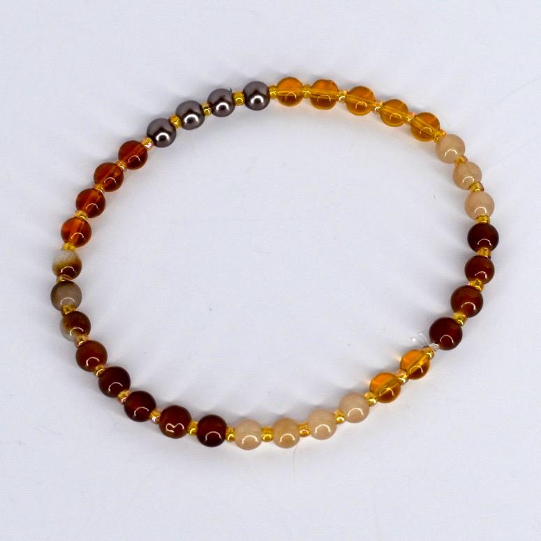 Beaded bracelet with multicolored beads on a white background