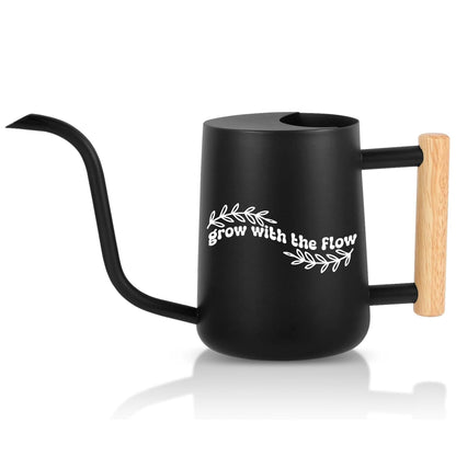 Black watering can with wooden handle and 'grow with the flow' text on a white background