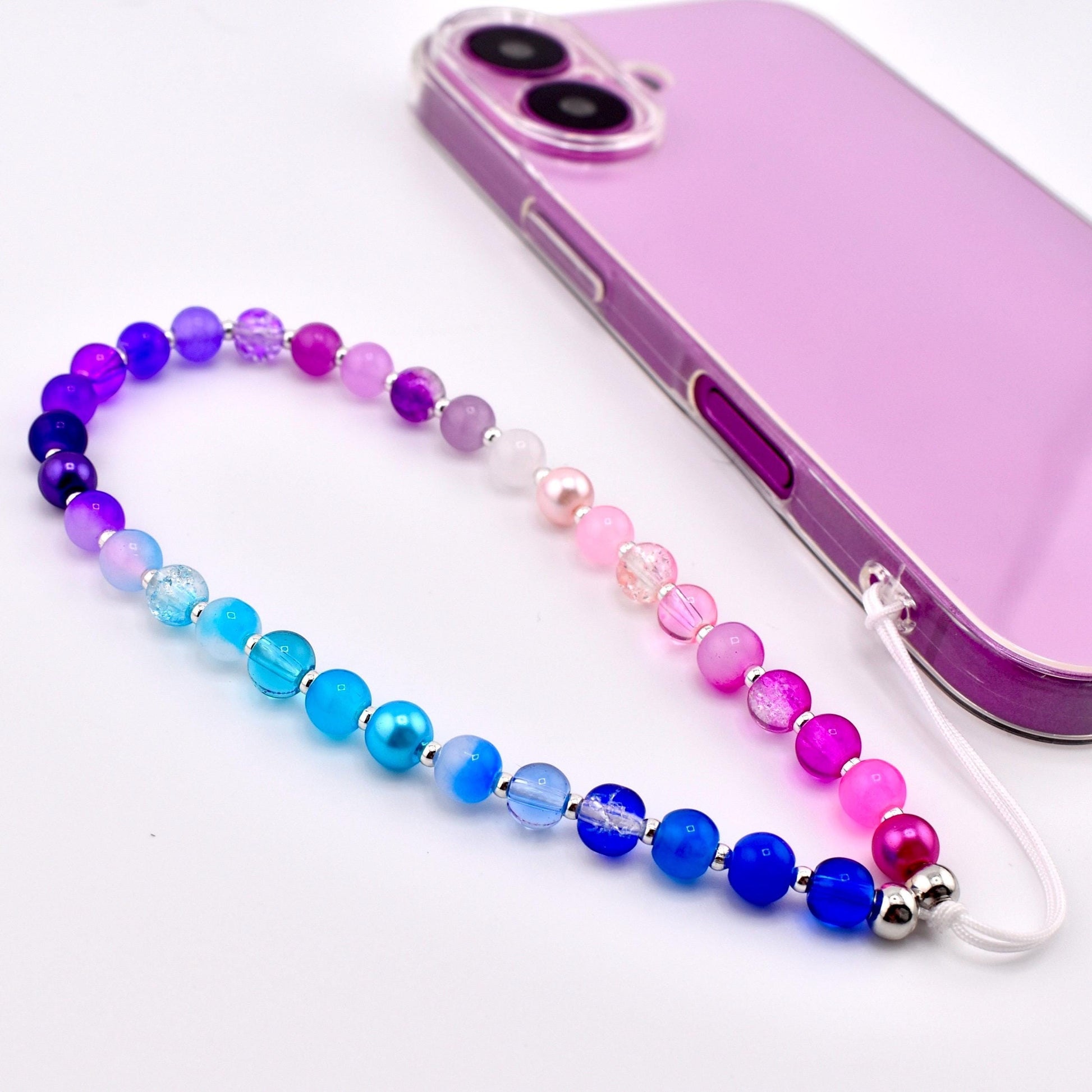 Calathea Collective pastel beaded phone charm wrist strap with blue, purple, and pink gradient beads and pearl accents.