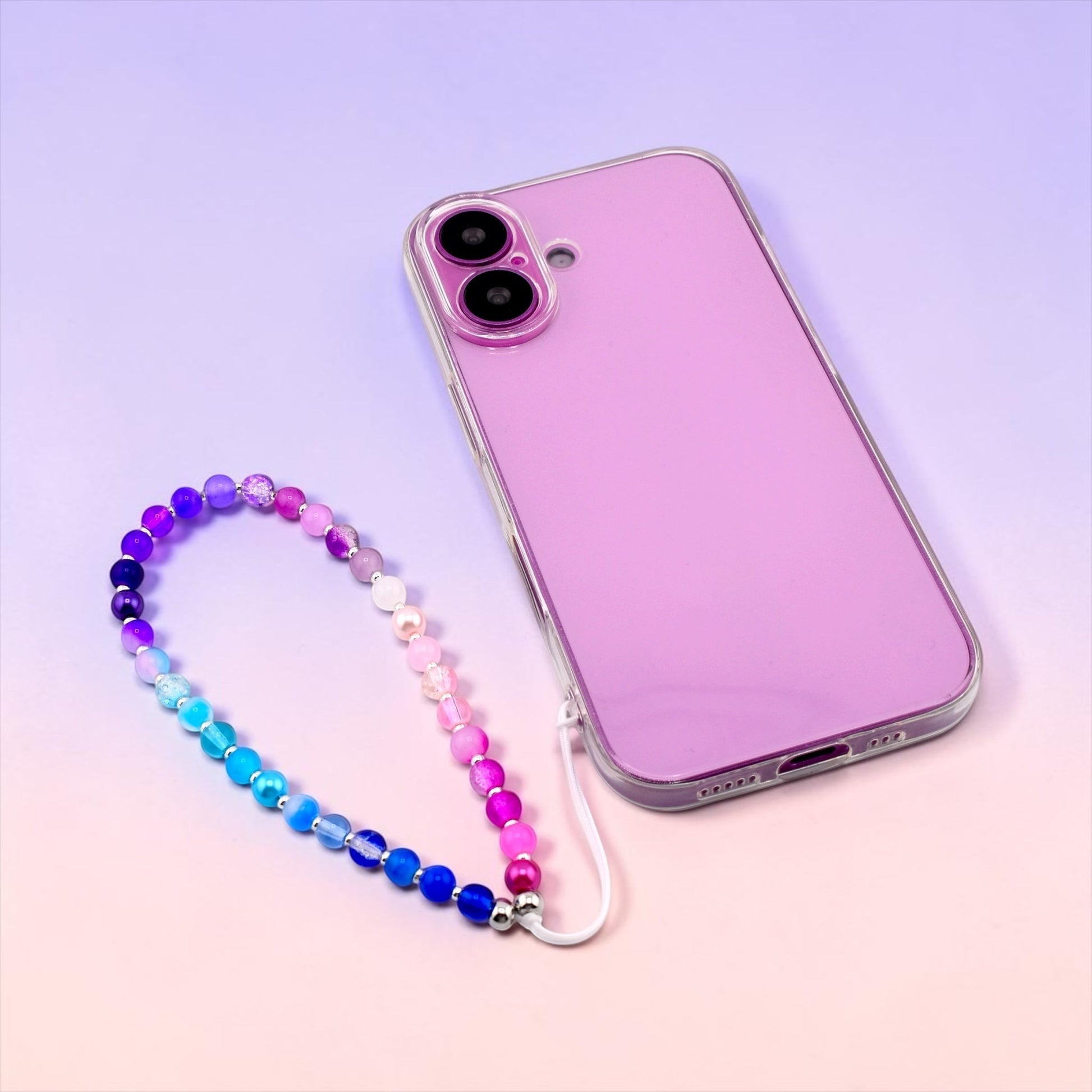 Calathea Collective pastel beaded phone charm wrist strap with blue, purple, and pink gradient glass beads and pearl accents.