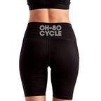 Calathea Collective black high-waisted bike shorts with side pockets and "OH-SO CYCLE" logo on back waistband.