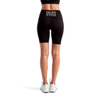 Calathea Collective black high-waisted bike shorts with pockets and "OH-SO CYCLE" logo on back waistband.