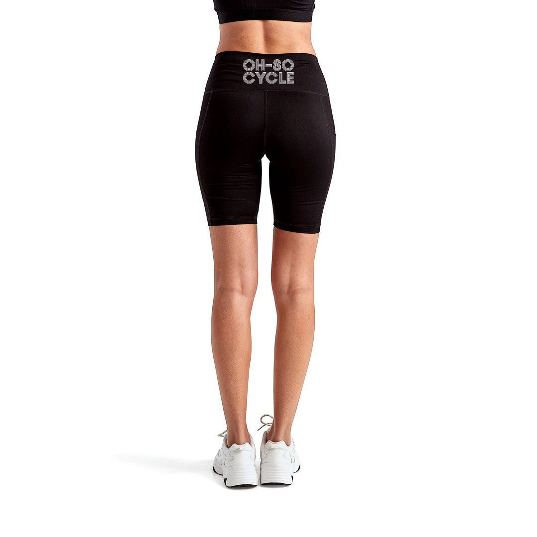 Calathea Collective black high-waisted bike shorts with pockets and "OH-SO CYCLE" logo on back waistband.