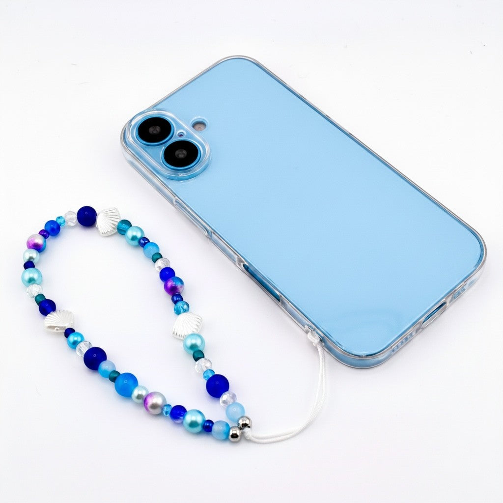Calathea Collective ocean blue seashell phone charm wrist strap with pearl and glass beads, silver seashell accents.