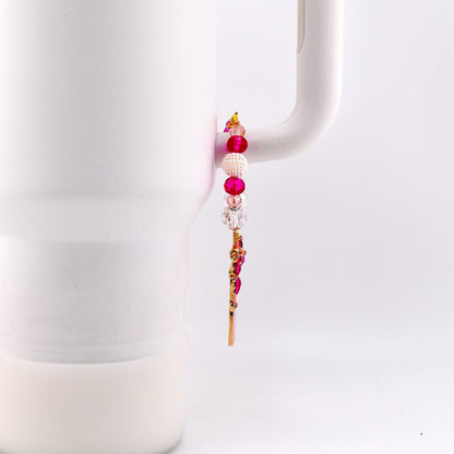 Calathea Collective pink star wand tumbler charm with pink, pearl, and crystal beads on a white tumbler handle.