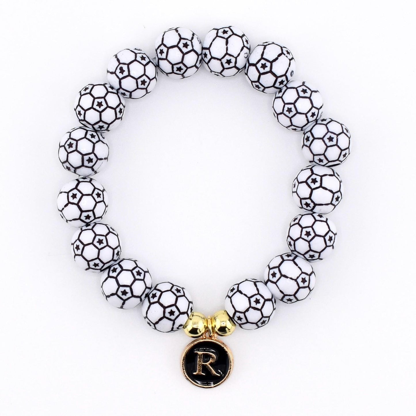 Calathea Collective soccer ball beaded bracelet with letter R charm and gold accent beads on a white background.