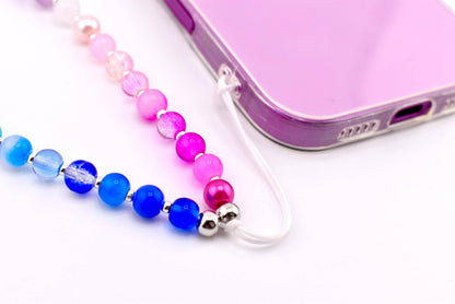 Calathea Collective pastel beaded phone charm wrist strap with blue, pink, and purple glass beads and pearl accents.