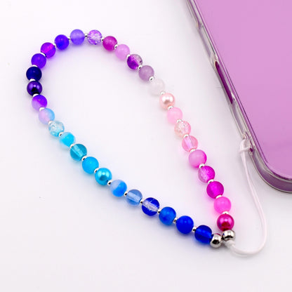 Calathea Collective pastel beaded phone charm wrist strap with blue, purple, and pink gradient, pearl beads, and silver spacers.