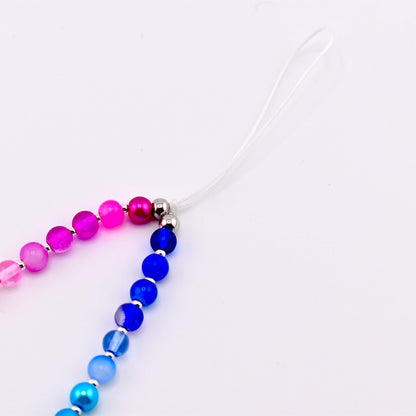 Calathea Collective pastel beaded phone charm wrist strap with pink, purple, blue, and pearl beads and silver spacers.