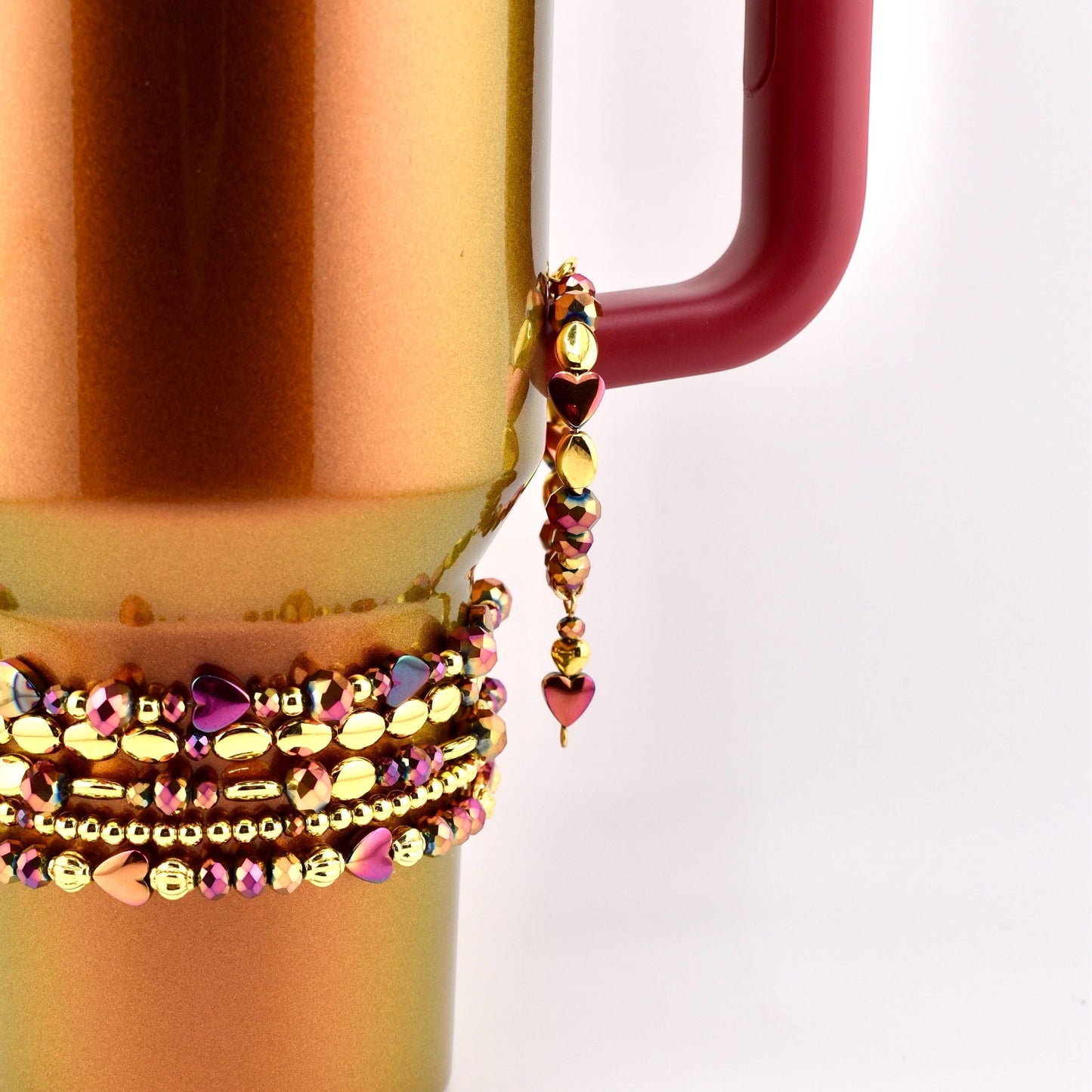 Calathea Collective Country Gold Tumbler Handle Bracelet with burgundy and gold beads and heart charms.