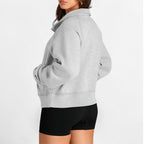 Calathea Collective gray cropped oversized quarter zip sweatshirt made of soft fleece with a stand-up collar and ribbed cuffs.