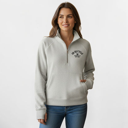 Calathea Collective light grey cropped oversized quarter zip sweatshirt with thumbholes and a front pouch pocket. Features black text graphic on chest.