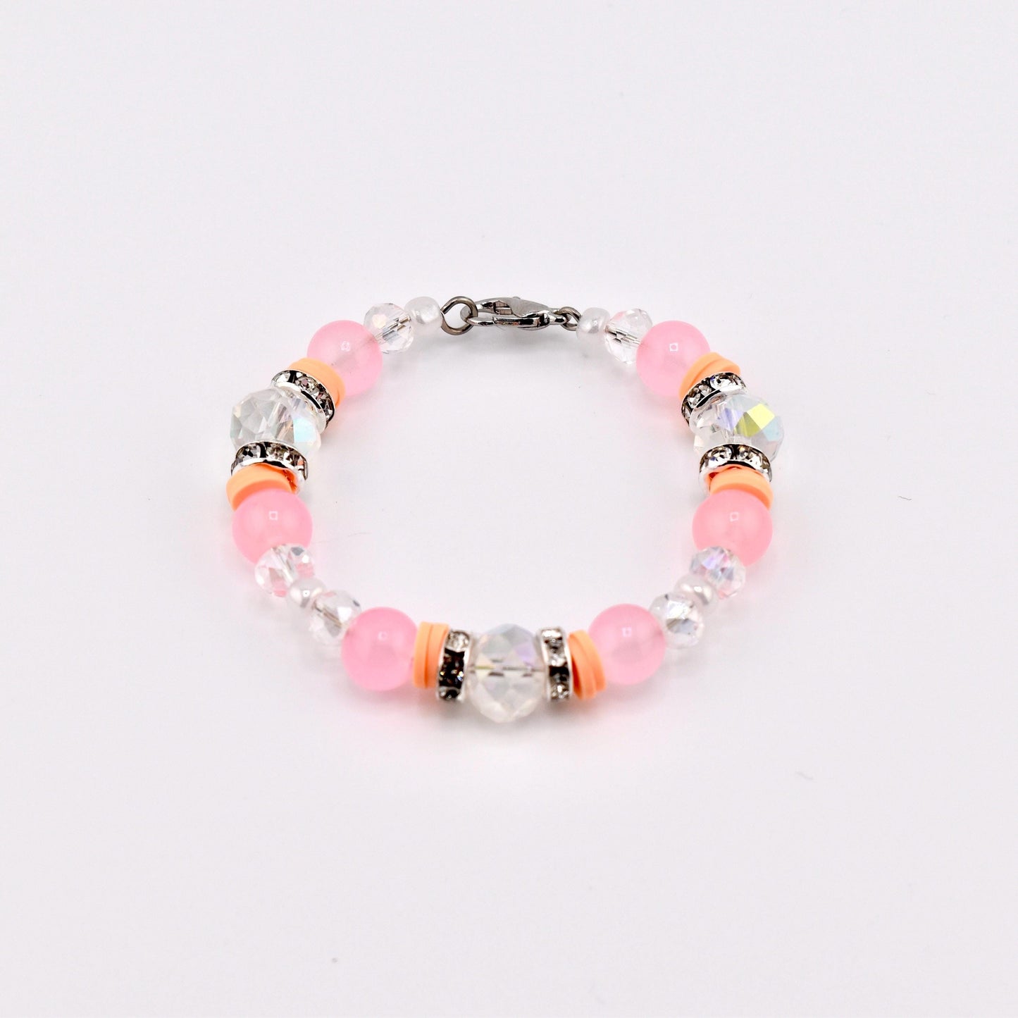 Calathea Collective pink mesa sunset beaded tumbler handle bracelet with peach, blush pink, and clear crystal beads and rhinestone accents.