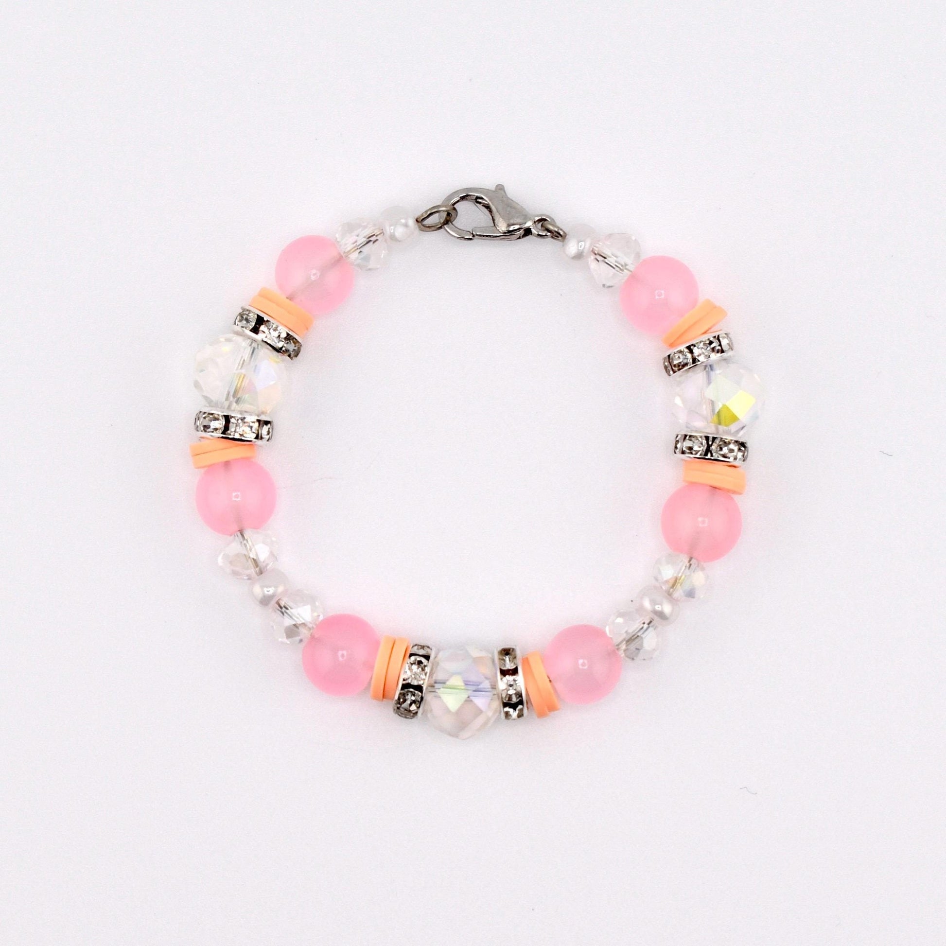 Calathea Collective pink mesa sunset tumbler handle bracelet with peach, blush pink, and clear beads, accented with rhinestones and a lobster clasp.