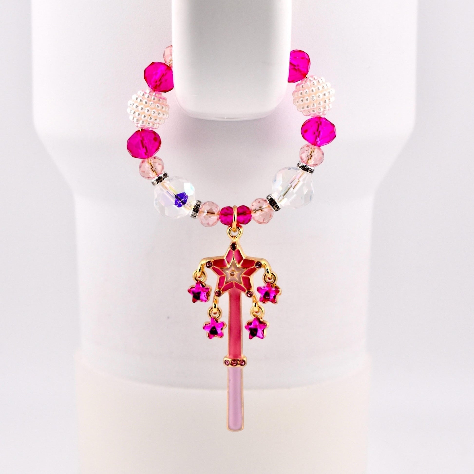 Calathea Collective pink star wand tumbler charm with pink, clear, and pearl beads. Dangles rhinestone stars.