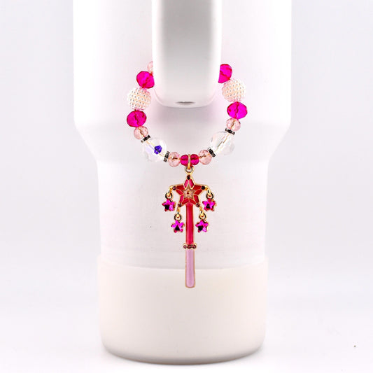 Calathea Collective pink star wand tumbler charm with fuchsia rhinestone stars and crystal beads on a white tumbler handle.