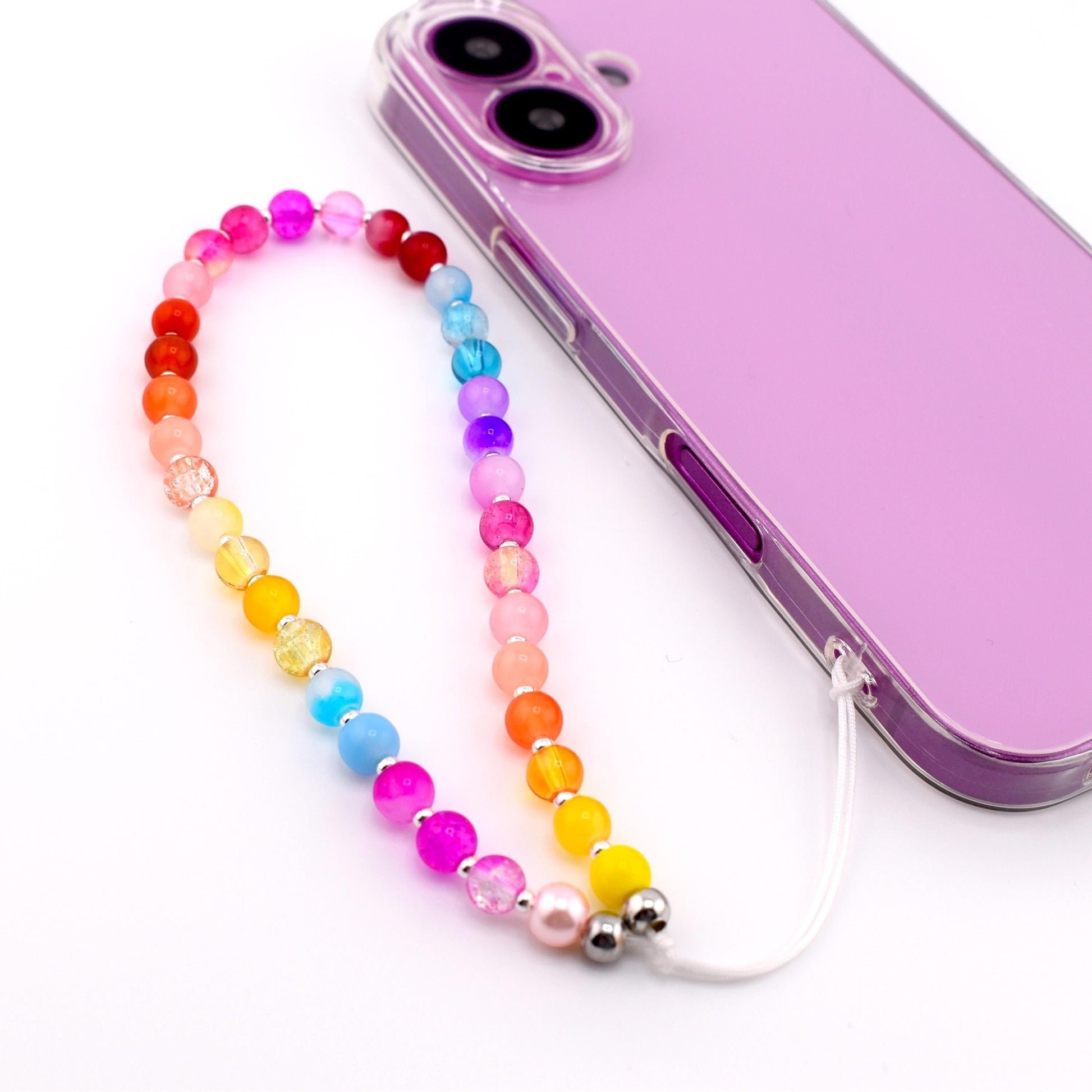 Calathea Collective rainbow beaded phone charm wrist strap with glass beads in pink, red, orange, yellow, blue, purple, and lavender.