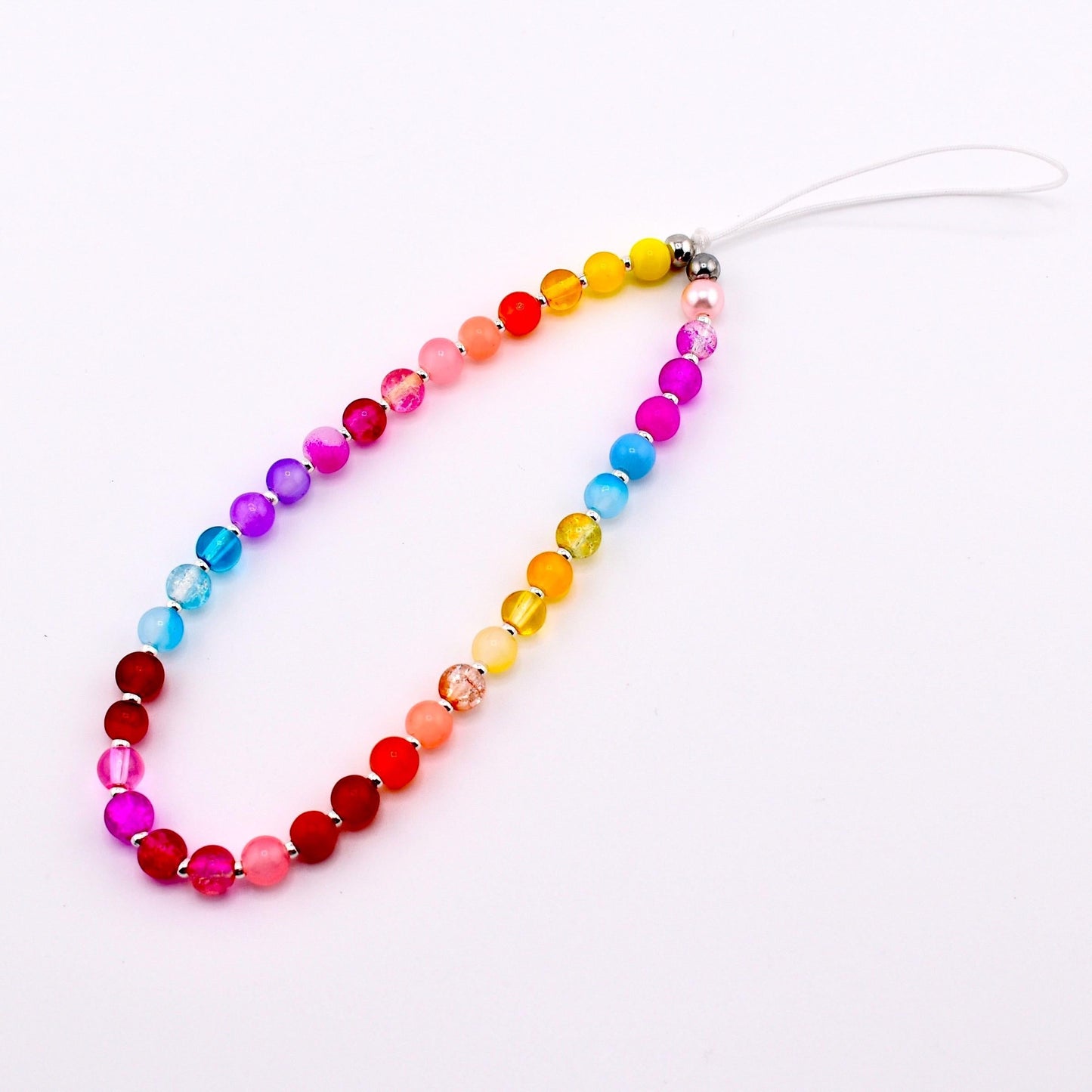 Calathea Collective rainbow beaded phone charm wrist strap with glass beads in pink, red, orange, yellow, blue, purple, and lavender.
