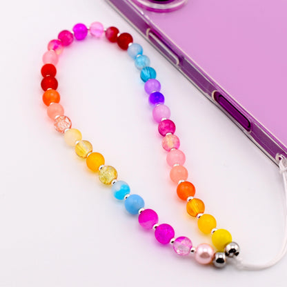 Calathea Collective rainbow beaded phone charm wrist strap with glass beads in pink, red, orange, yellow, blue, and purple.
