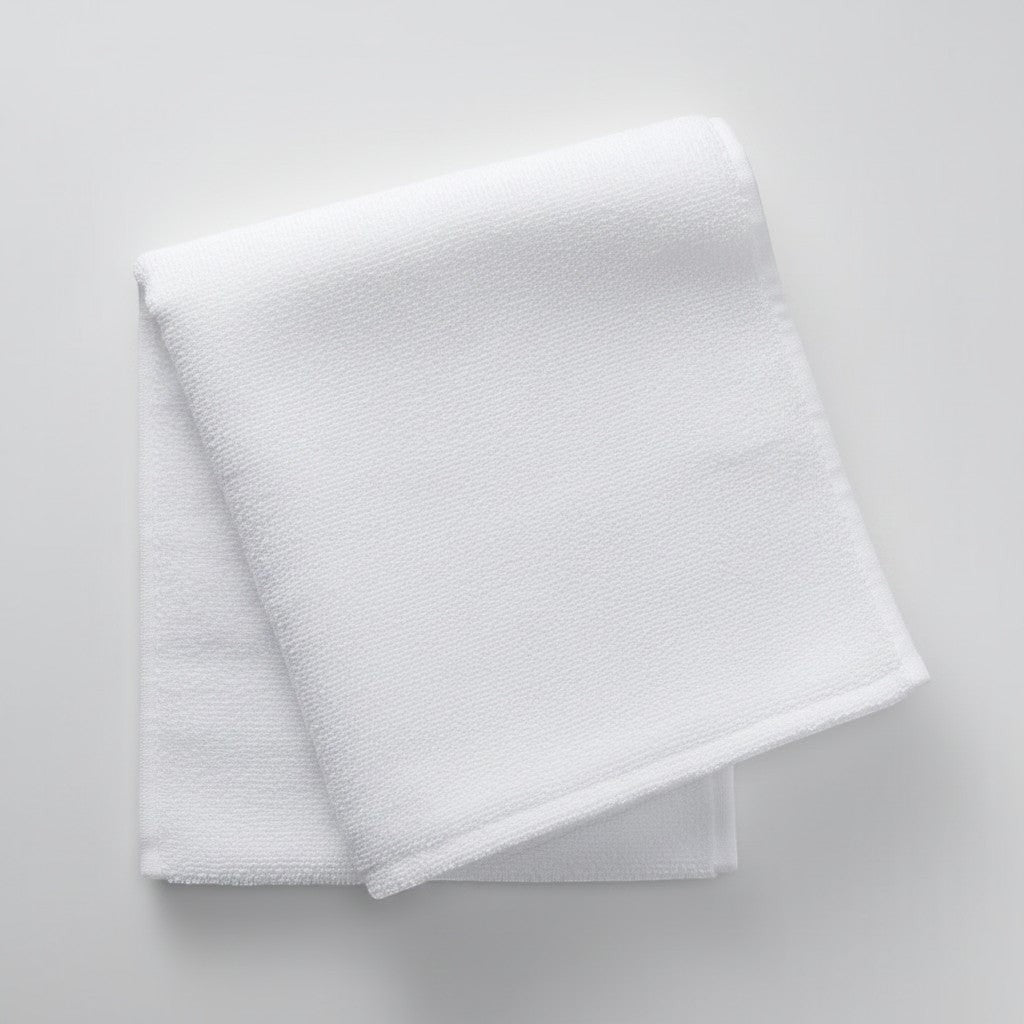 Calathea Collective white terry cloth sweat towel with Oh So Cycle logo, perfect for indoor cycling classes.