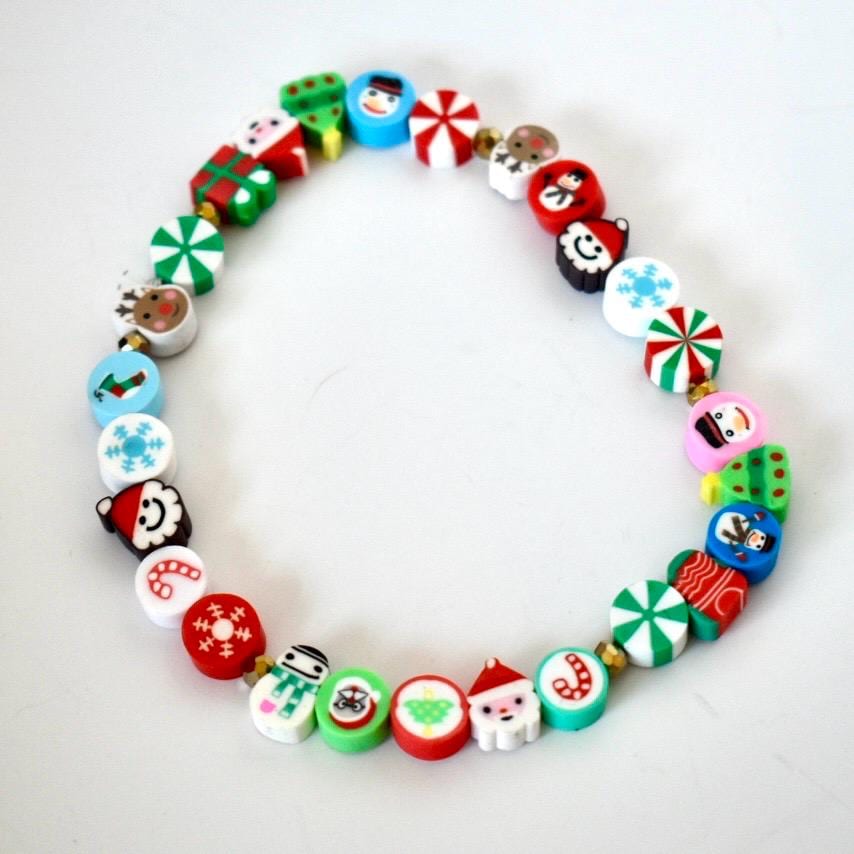 Colorful Christmas-themed beaded bracelet on a white background