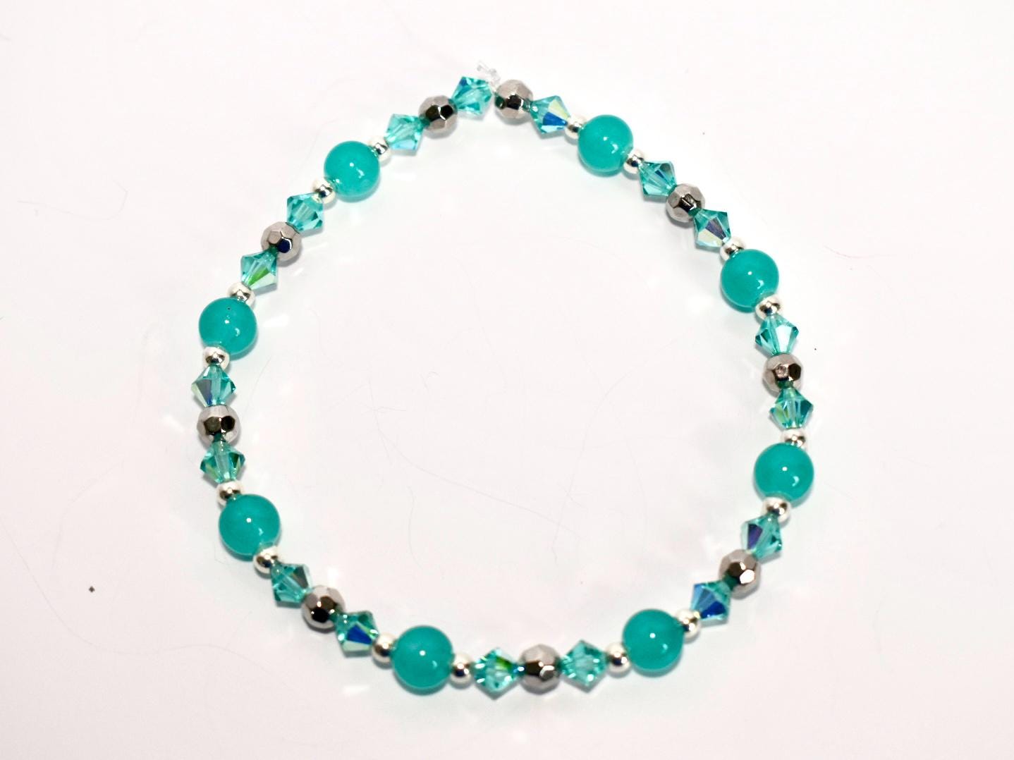 Turquoise beaded bracelet on a white background