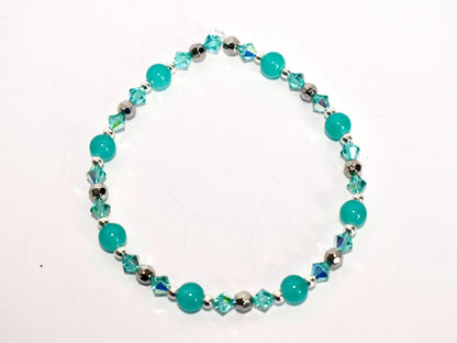 Turquoise beaded bracelet on a white background