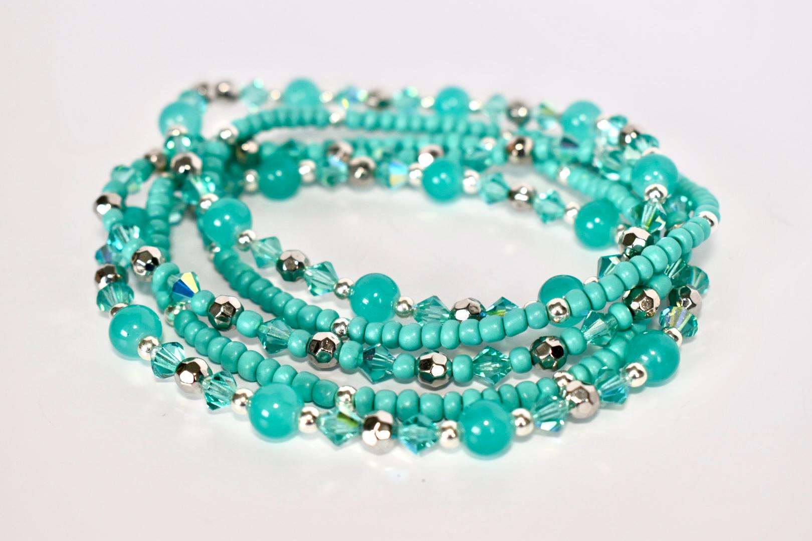Turquoise beaded bracelets on a white background