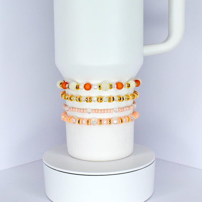 Orange and Gold Bracelet Stack with Pearl and Clear Bead Accents