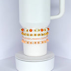 Orange and Gold Bracelet Stack with Pearl and Clear Bead Accents