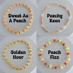 Orange and Gold Bracelet Stack with Pearl and Clear Bead Accents