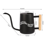 Black watering can with a wooden handle. The can has a spout and a white inscription that reads 'grow with the flow'. The can is 10.2 inches tall, 5.4 inches wide, 4.2 inches deep, and 7 inches long.