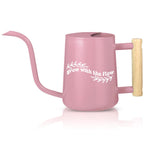 Pink watering can with wooden handle and white Grow with the Flow text surrounded by leaf graphics perfect calming gift for plant lovers and self-care moments