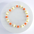 Orange and Gold Bracelet Stack with Pearl and Clear Bead Accents