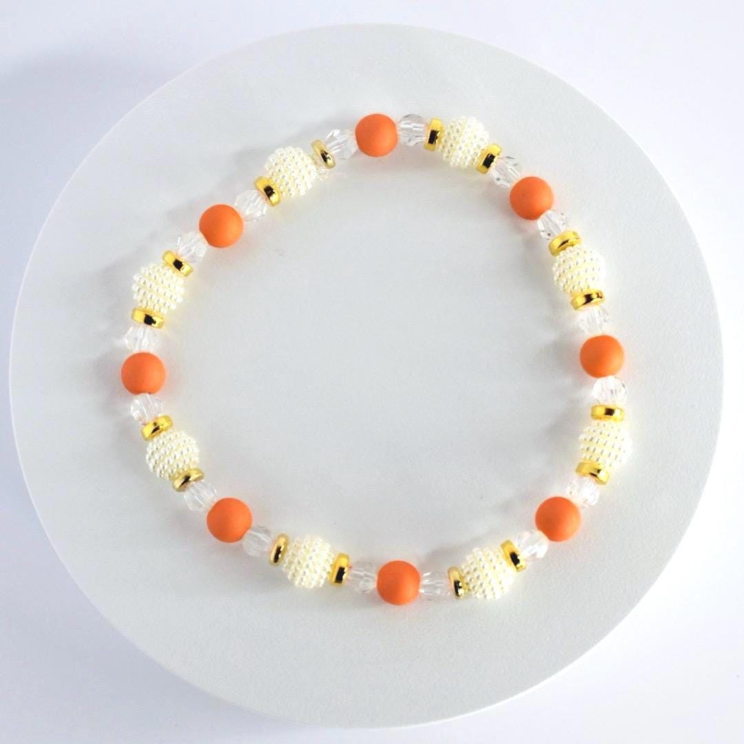 Orange and Gold Bracelet Stack with Pearl and Clear Bead Accents
