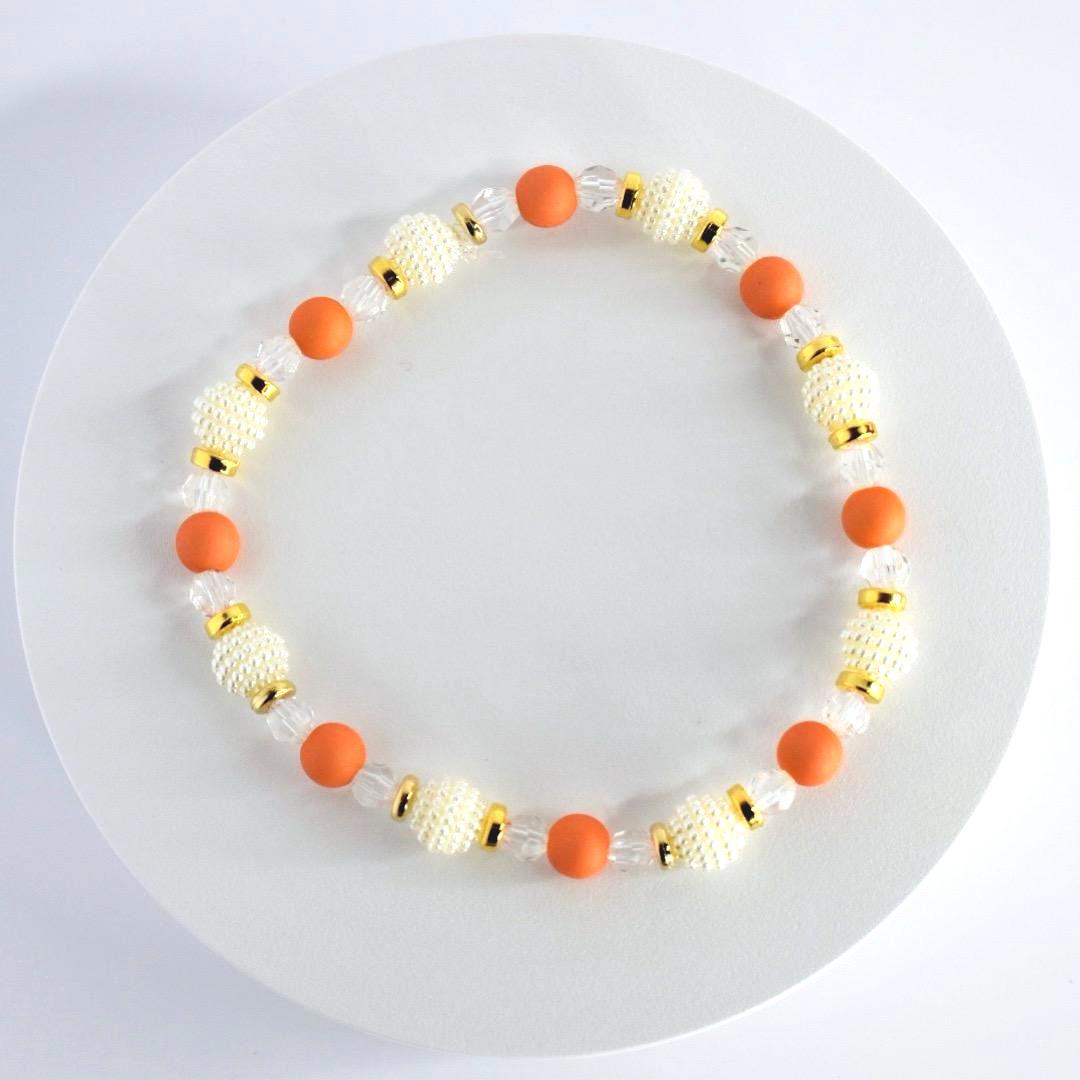 Orange and Gold Bracelet Stack with Pearl and Clear Bead Accents
