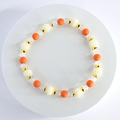 Orange and Gold Bracelet Stack with Pearl and Clear Bead Accents