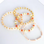 Orange and Gold Bracelet Stack with Pearl and Clear Bead Accents