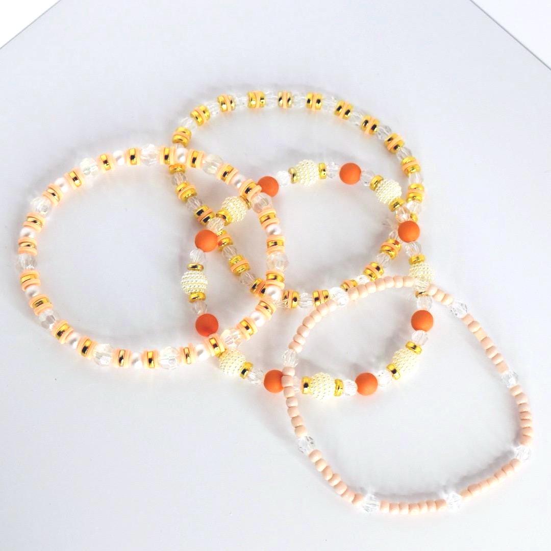 Orange and Gold Bracelet Stack with Pearl and Clear Bead Accents