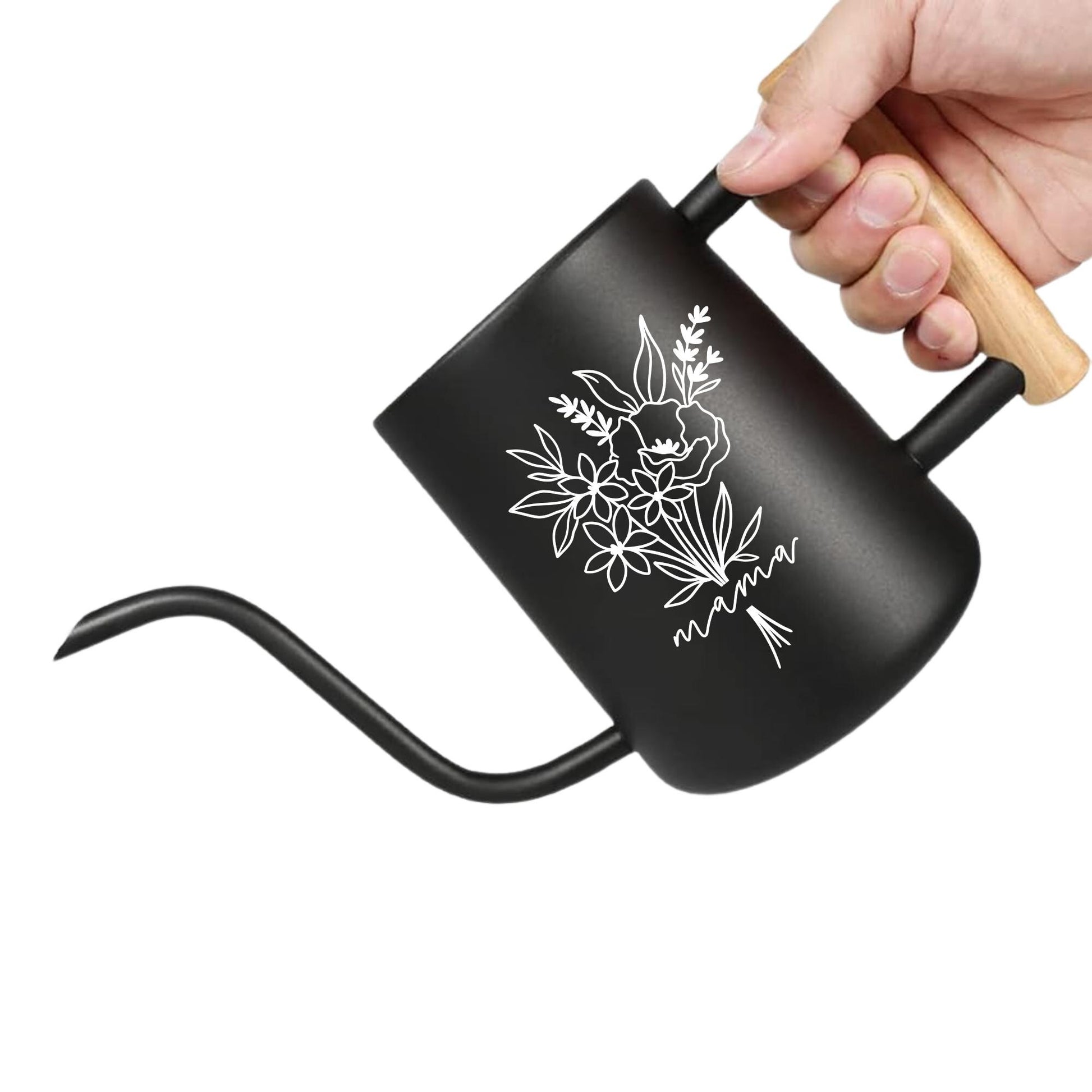 A black watering can with a wooden handle. The watering can has a floral design and the word 'mama' written on it.
