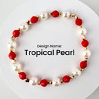 A beaded bracelet with the text "Tropical Pearl." The bracelet features alternating white pearl beads and red faceted beads, with gold-colored star and round accents.